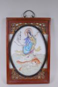 A Chinese republic style polychrome porcelain panel depicting Quan Yin standing on a carp, mounted