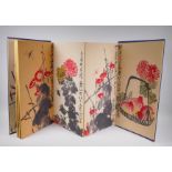 A Chinese printed concertina watercolour book depicting insects, birds, flowers and fruit, 30 x 59cm