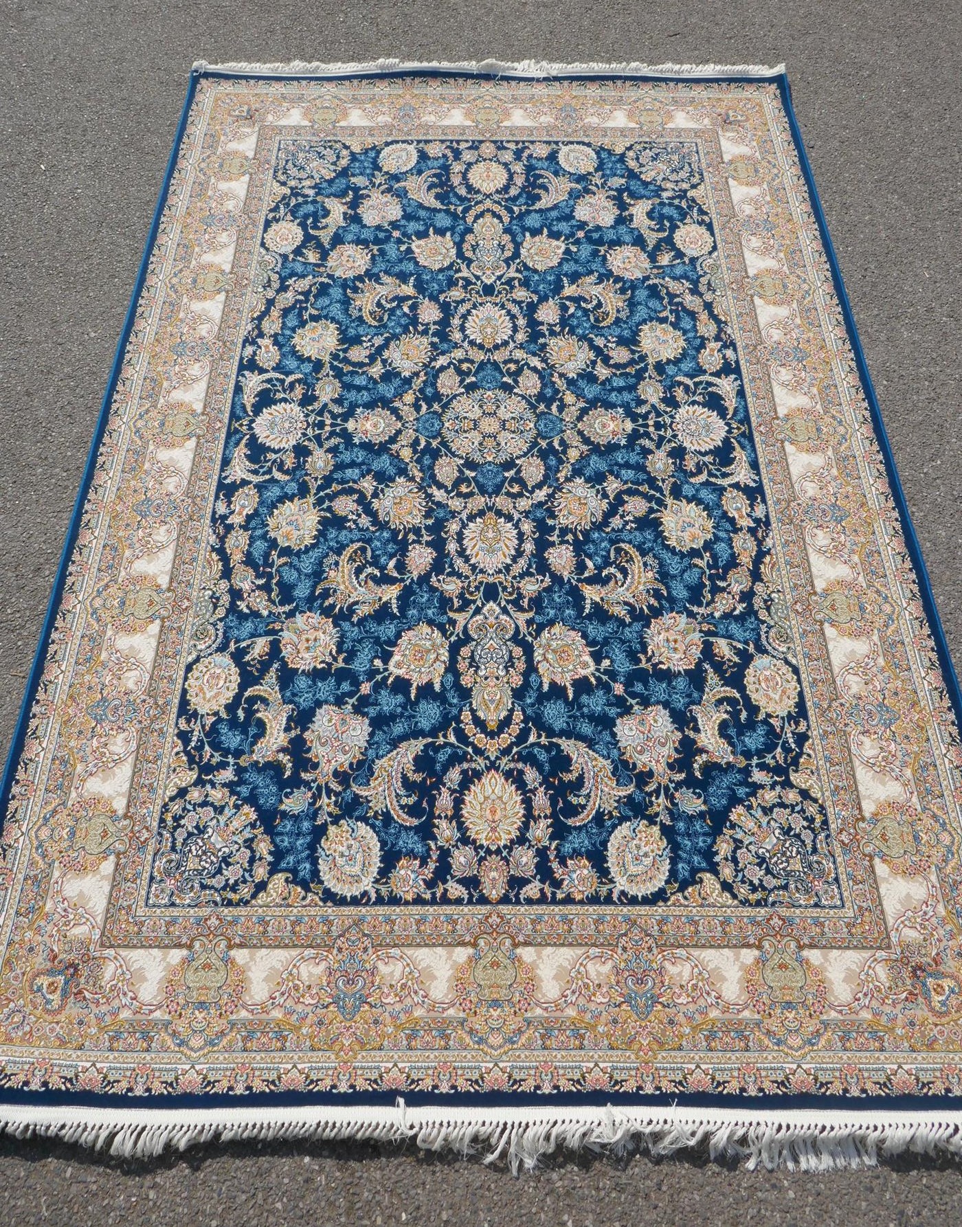 A fine woven blue and cream ground Persian carpet full pile with traditional allover floral
