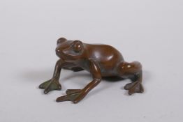 A Japanese style bronze okimono frog, seal mark to base, 5cm long