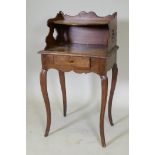 An early C19th French fruitwood single drawer side table with shaped gallery and pierced sides,