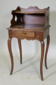 An early C19th French fruitwood single drawer side table with shaped gallery and pierced sides,