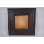 A C19th elaborately carved mahogany frame, 25 x 25cm