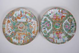 A pair of C19th Canton famille rose porcelain cabinet plates, decorated with figures conversing,