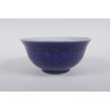 A Chinese blue glazed porcelain bowl with underglaze lotus flower decoration, Xuande 6 character