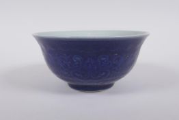 A Chinese blue glazed porcelain bowl with underglaze lotus flower decoration, Xuande 6 character
