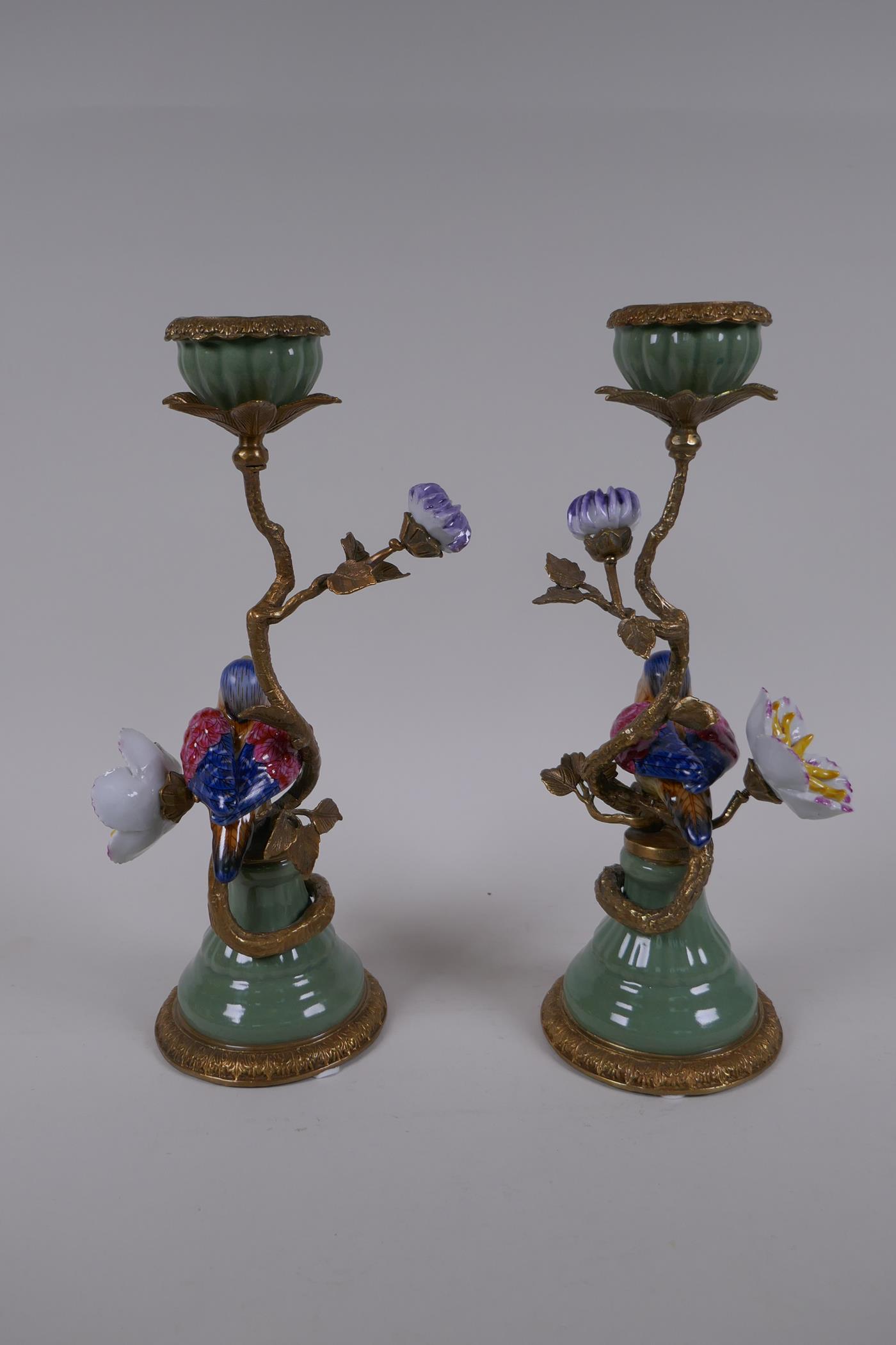 A pair of polychrome porcelain and gilt metal candlesticks decorated with birds and flowers, 29cm - Image 3 of 4