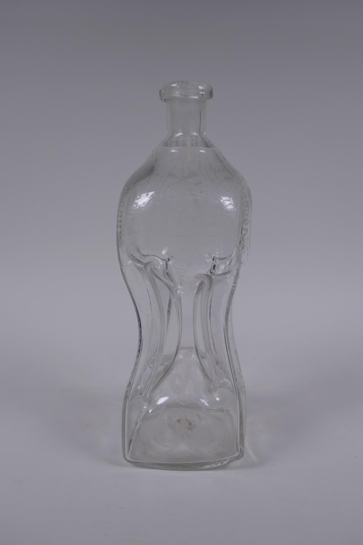 An antique glass bottle of pinched waist form and etched decoration, 28cm high - Image 4 of 5