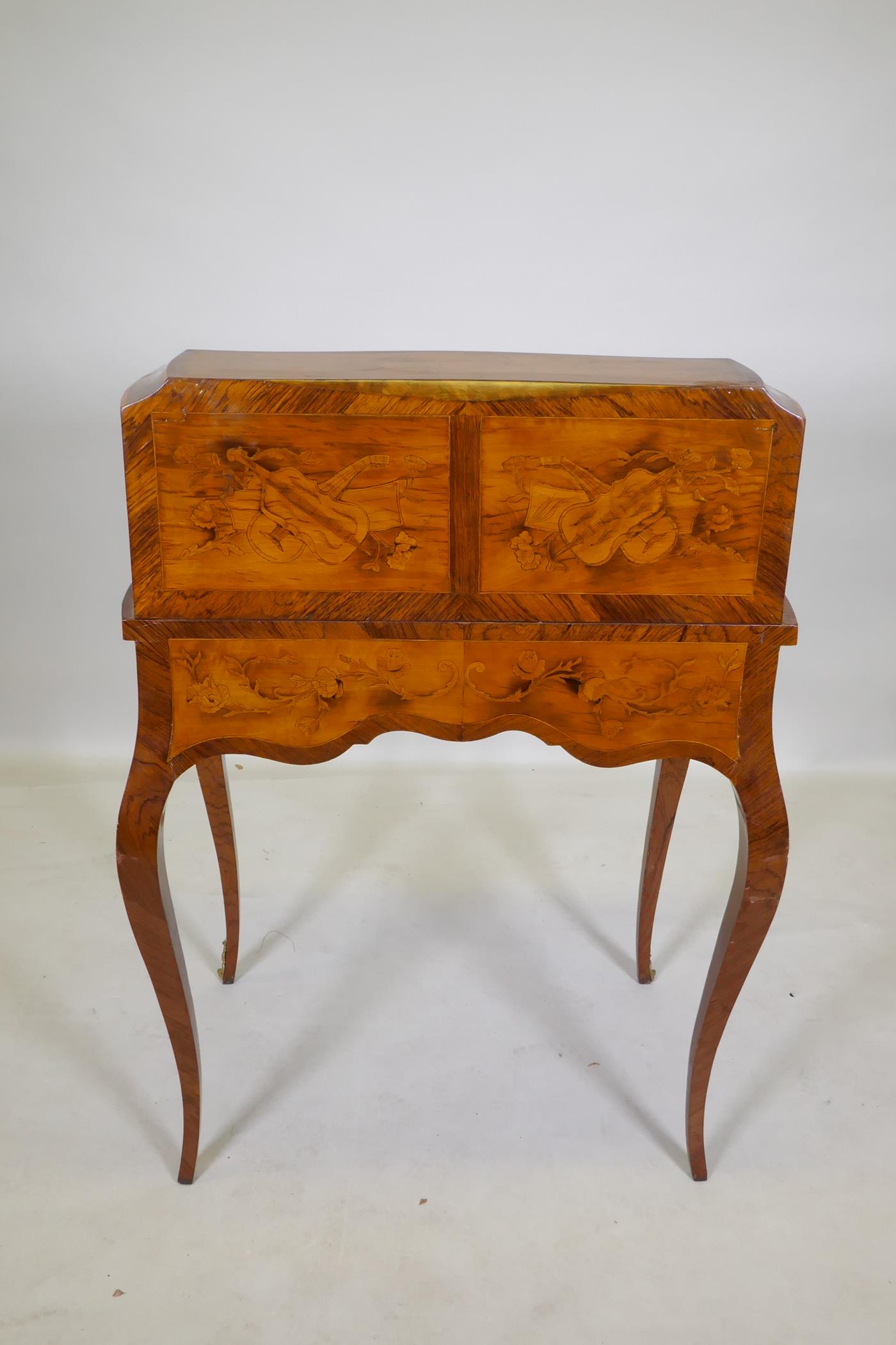 A rosewood marquetry inlaid bureau, with shaped top and cylinder front, the interior fitted with - Image 9 of 9