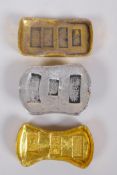 A pair of Chinese gilt metal trade tokens/ingots, and a similar white metal token, largest 6 x 3cm