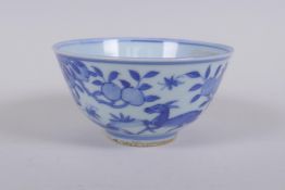 A blue and white porcelain rice bowl decorated with animals and a peach tree, Chinese Jia Jing 6