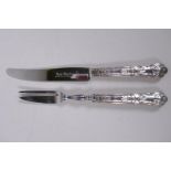 A set of six silver handled tea knives and a matching set of cake forks by Harrison Brothers,