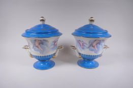A pair of Sevres style porcelain urns and covers with two handles, decorated with winged putti, 28cm