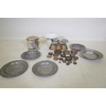 A set of antique weighing scales and weights, a pair of pewter plates with heraldic designs, a C19th