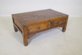 An antique Chinese elm opium table with two drawers, 65 x 40cm, 25cm high