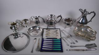 A quantity of silver plate to include a three piece tea set, jugs, pierced basket, flatware etc,