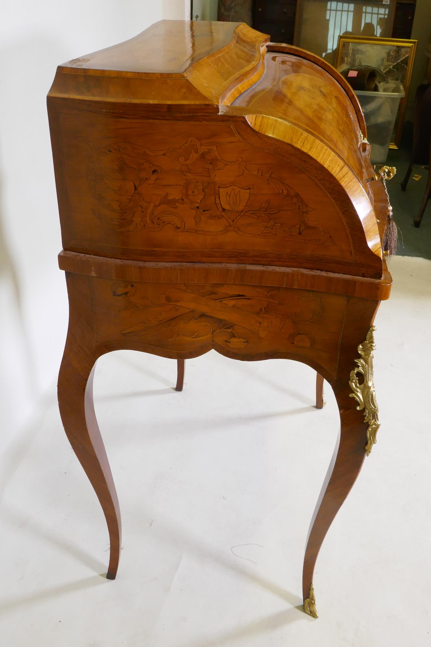 A rosewood marquetry inlaid bureau, with shaped top and cylinder front, the interior fitted with - Image 8 of 9