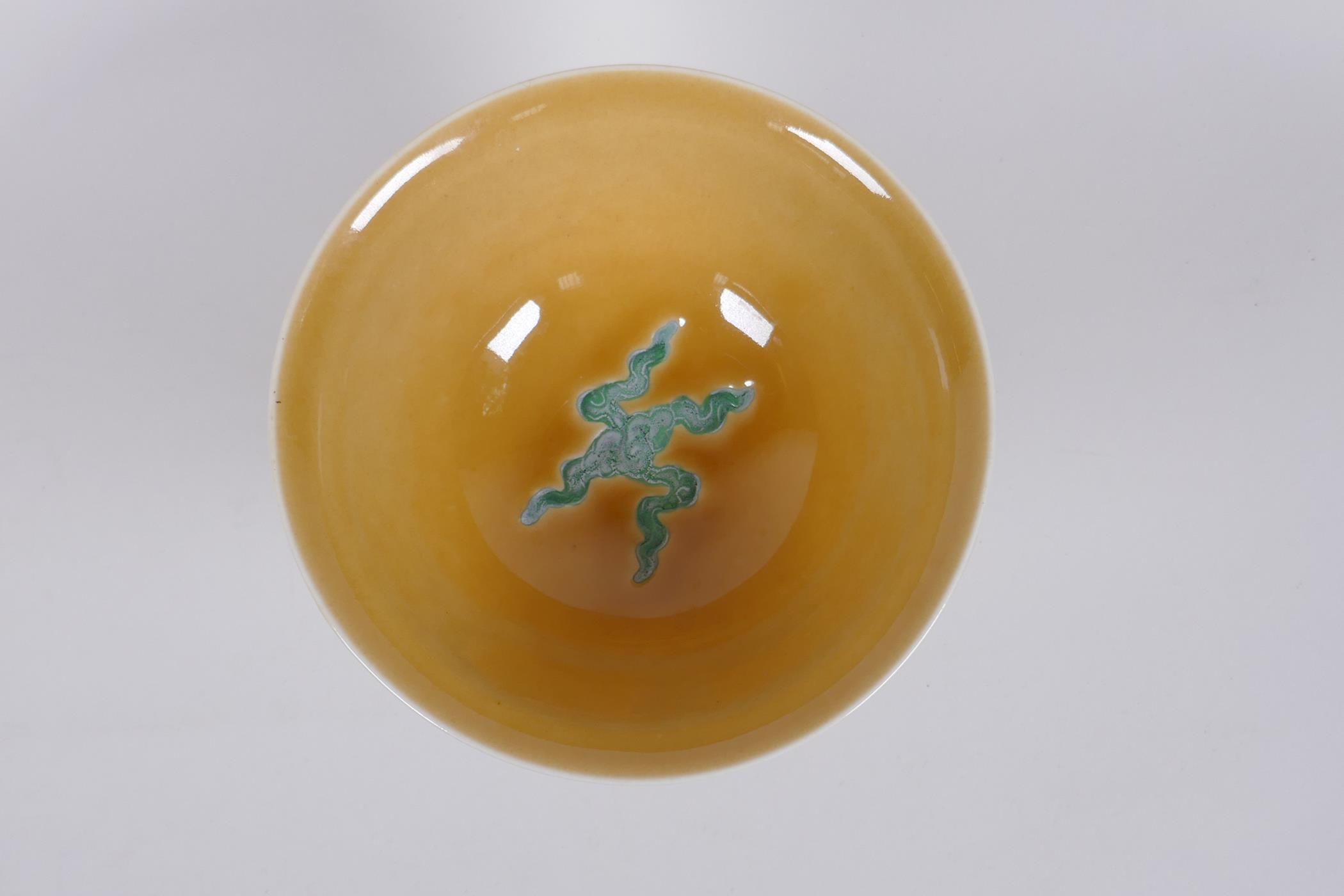 A Chinese yellow ground porcelain stem bowl with raised green enamelled dragon decoration, Xuande - Image 5 of 7