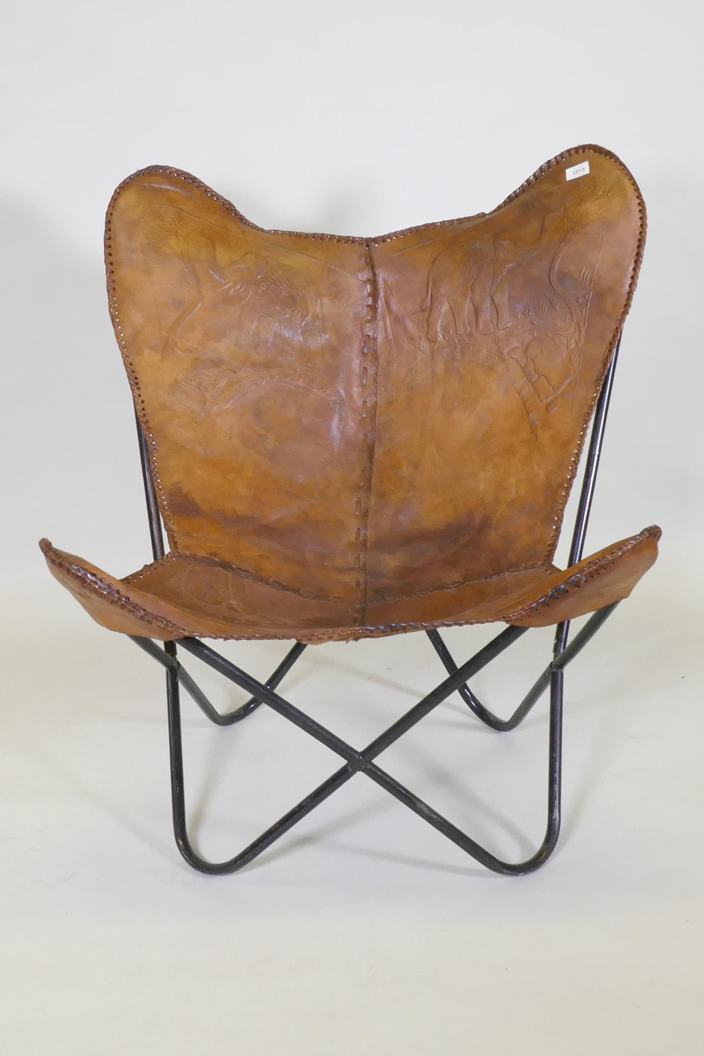 A leather butterfly chair with tooled elephant decoration, on a tubular metal frame - Image 2 of 4