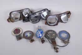 Two pairs of vintage Stadium motorcycle goggles and another similar pair, all early to mid C20th,