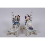 A pair of C19th Royal Dux porcelain figures of seated musicians, printed marks to base, AF, 19cm