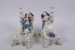 A pair of C19th Royal Dux porcelain figures of seated musicians, printed marks to base, AF, 19cm