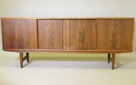 A mid century Danish sideboard, designed by E.W. Bach for Sejling Skaed Silkeborg, four sliding