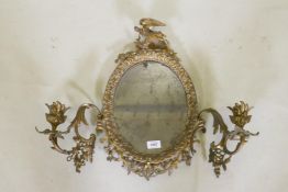A C19th ormolu brass two branch girondelle, with original distressed silvered glass, 49cm high