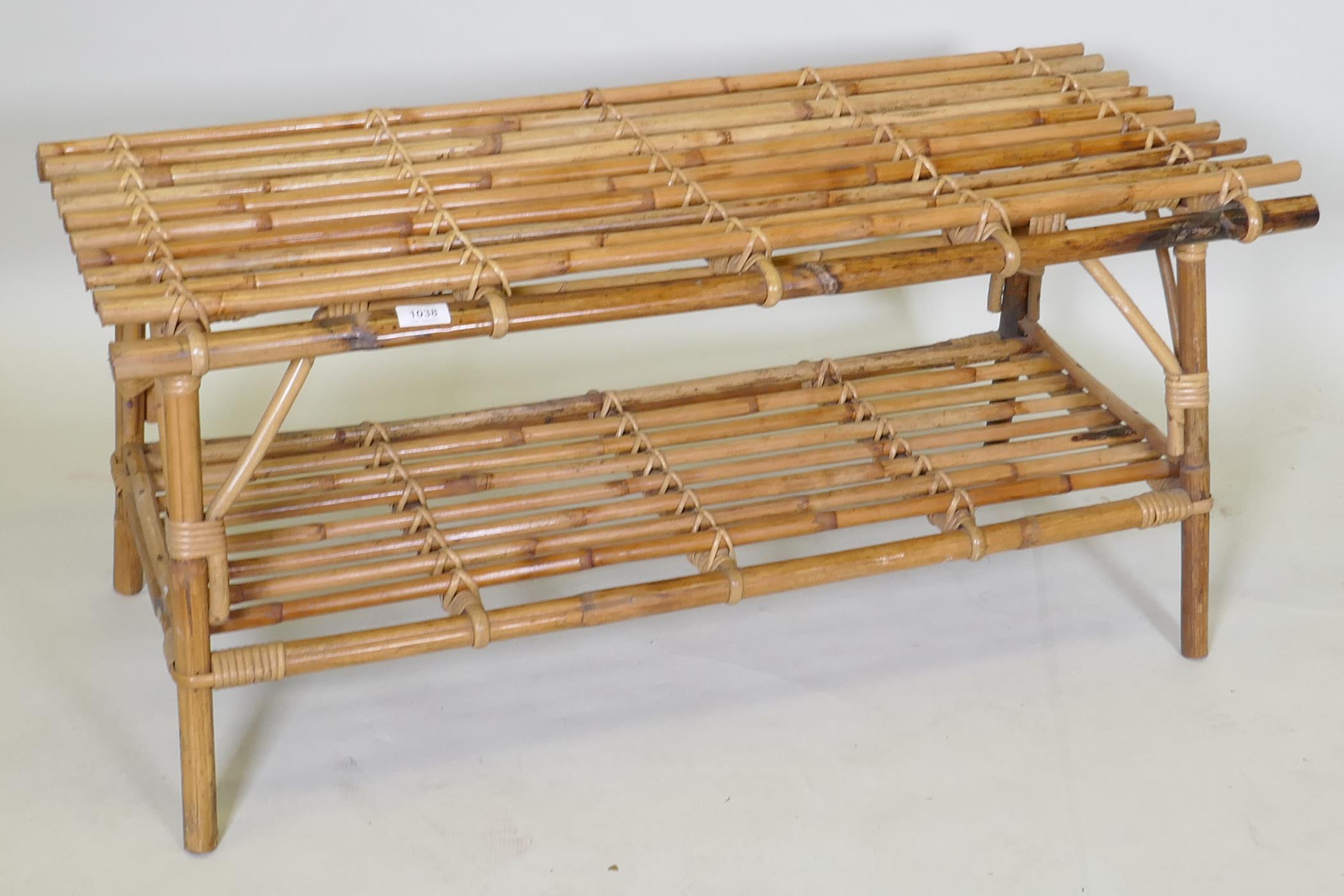 A two tier bamboo occasional table, 102 x 48cm, 45cm high