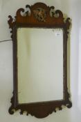 A Georgian style fret work wall mirror with parcel gilt decoration and ho-ho bird crest, late