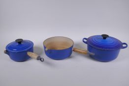 A Le Creuset 21cm cast iron casserole dish, a smaller sauce pan with pouring spout and a milk pan