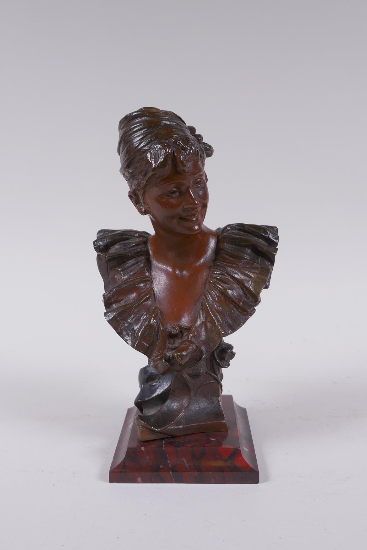 Georges van der Straeten (Belgian, 1856-1928), a bronze bust of a girl, bears signature to the