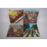 Four original Beatles vinyl albums including two first pressings of Sgt Pepper's Lonely Hearts