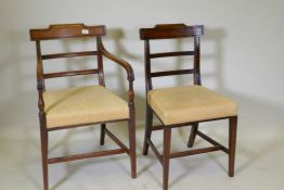 A set of eight (six plus two) Regency mahogany dining chairs, the bar backs with carved scroll top