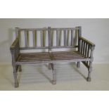 A slatted teak garden bench, 125 x 62cm, 84cm high