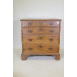 A Georgian oak garret chest in two sections, original brass fret handles and scratch moulded