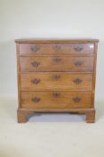 A Georgian oak garret chest in two sections, original brass fret handles and scratch moulded