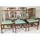 A set of six (four plus two) Georgian style mahogany dining chairs with pierced splat backs and drop