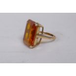 A vintage 9ct gold dress ring set with a large yellow topaz, size P, 11.6g gross
