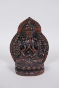 A Sino Tibetan coppered bronze figure of a many armed Buddha, 15cm high