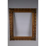 A late C19th gilt picture frame, with leaf and scroll decoration, rebate 61 x 48cm