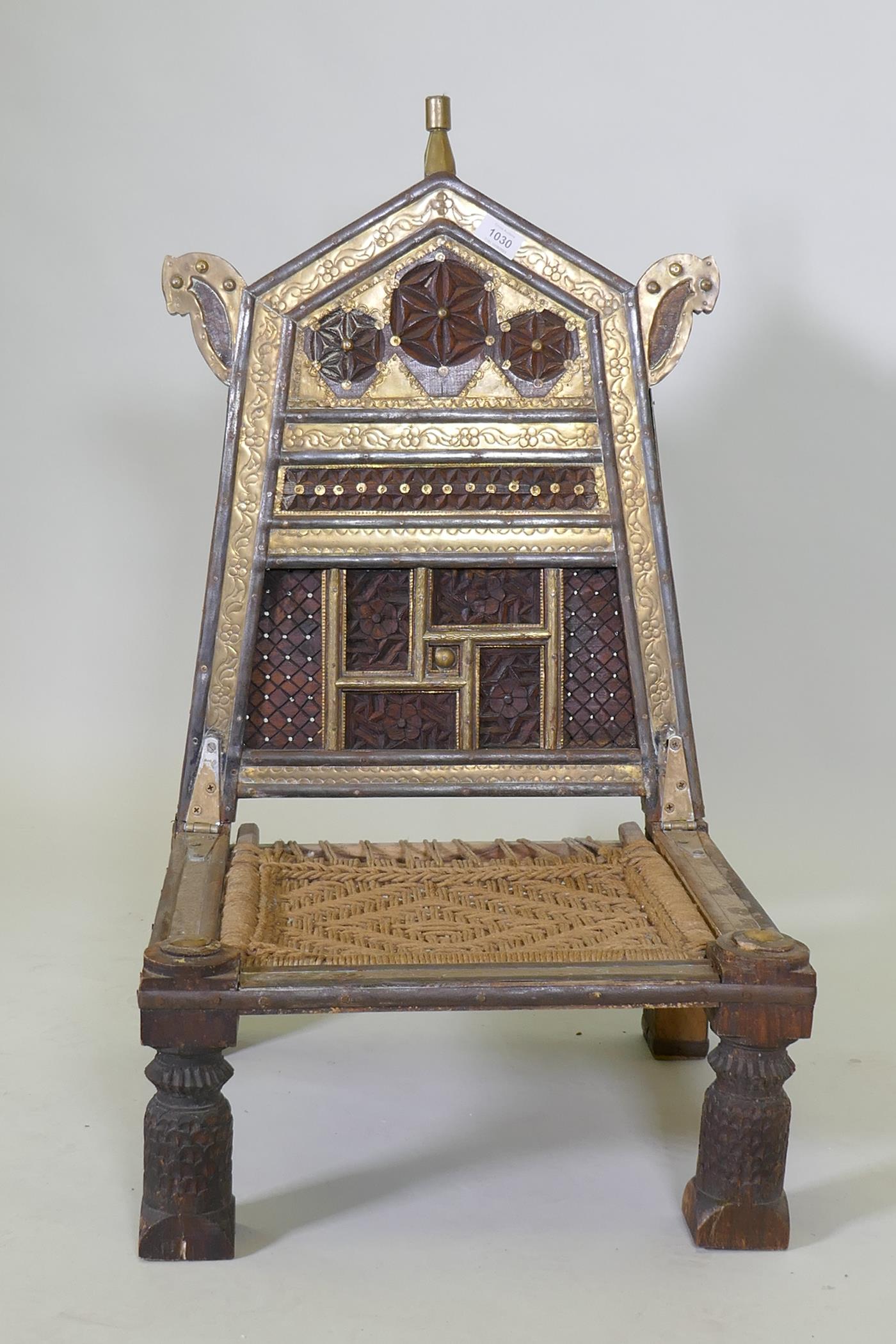 An antique Indian Pidha low chair with folding back, brass and iron mounts and webbed seat - Image 2 of 4