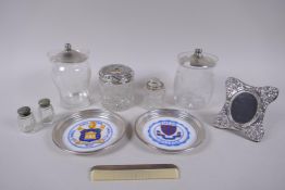A collection of hallmarked silver and white metal mounted items, including a photograph frame, comb,