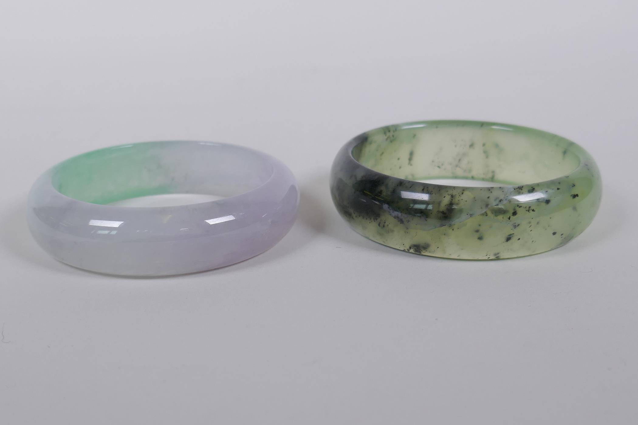 A bi-colour jade bangle, and another, 7cm diameter - Image 2 of 2