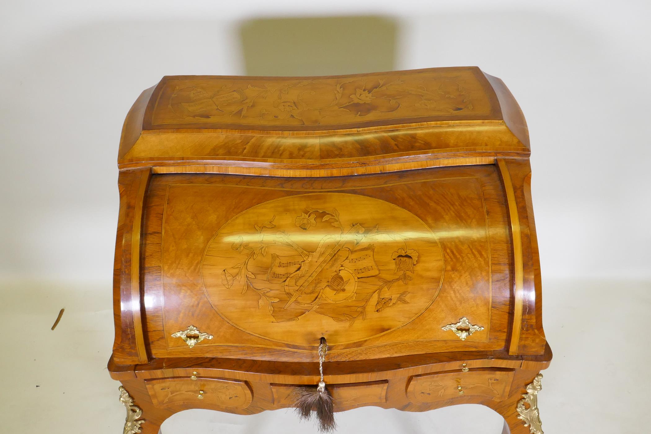 A rosewood marquetry inlaid bureau, with shaped top and cylinder front, the interior fitted with - Image 6 of 9