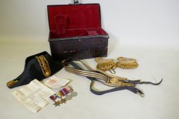 A Royal Navy ship's officer's dress uniform, hat, sword, belt and epaulettes belonging to Surgeon