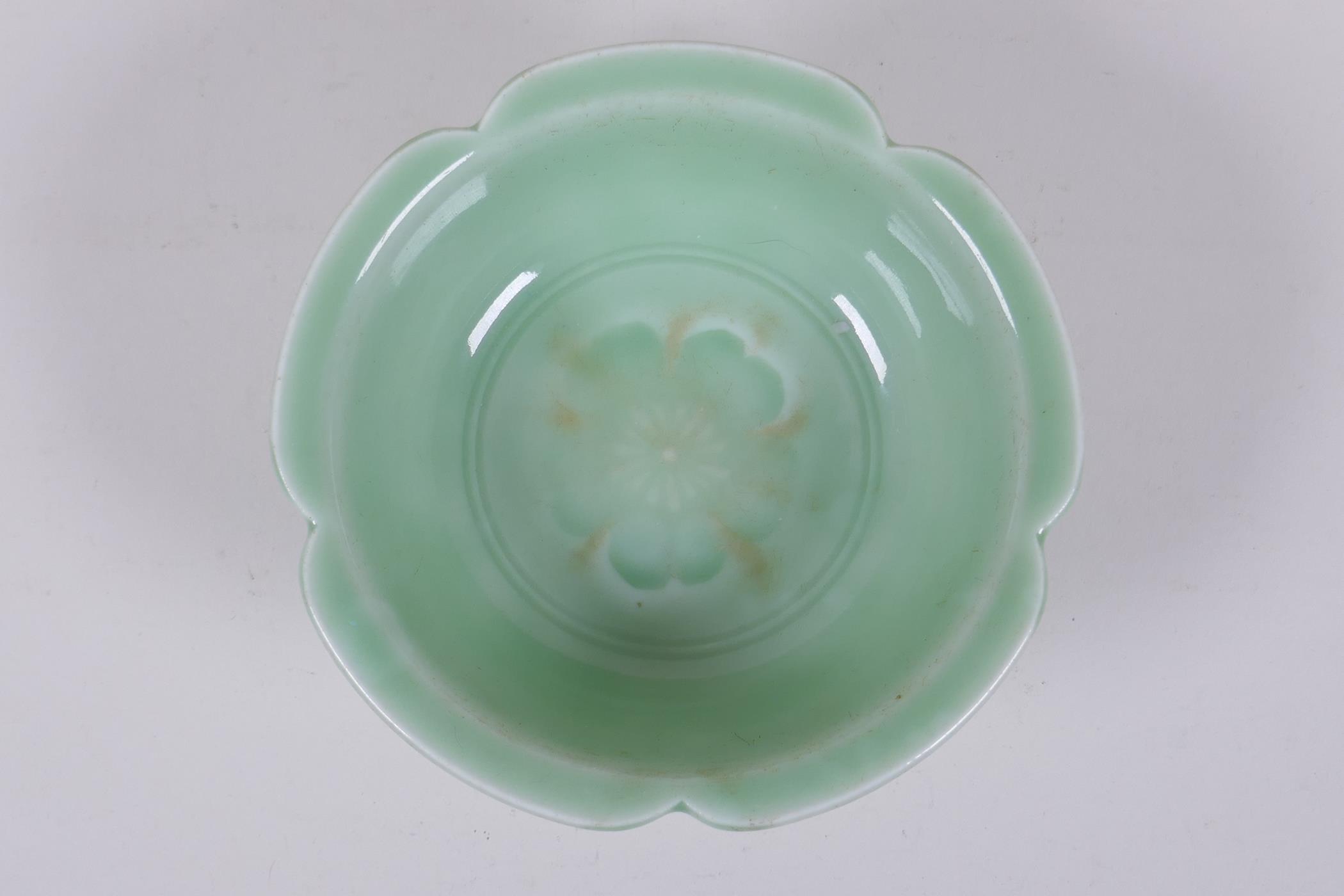 An oriental green glazed porcelain petal shaped bowl with underglaze prunus decoration, 14cm - Image 2 of 3