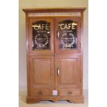 An antique teak cabinet with glazed and painted doors to the upper section and a tiled frieze, 118 x