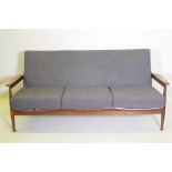 A mid century afrormosia Manhattan three seater settee designed by George Fejer and Eric Pamphilon