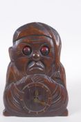 A vintage carved wood figural automaton clock with moving eyes, 18cm high